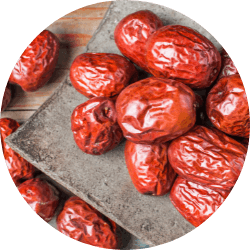 An image showcasing ripe jujube fruits, signifying the source of jujube seeds, one of the traditional botanical ingredients used in Revvl Sleep to induce calmness and improve sleep quality.